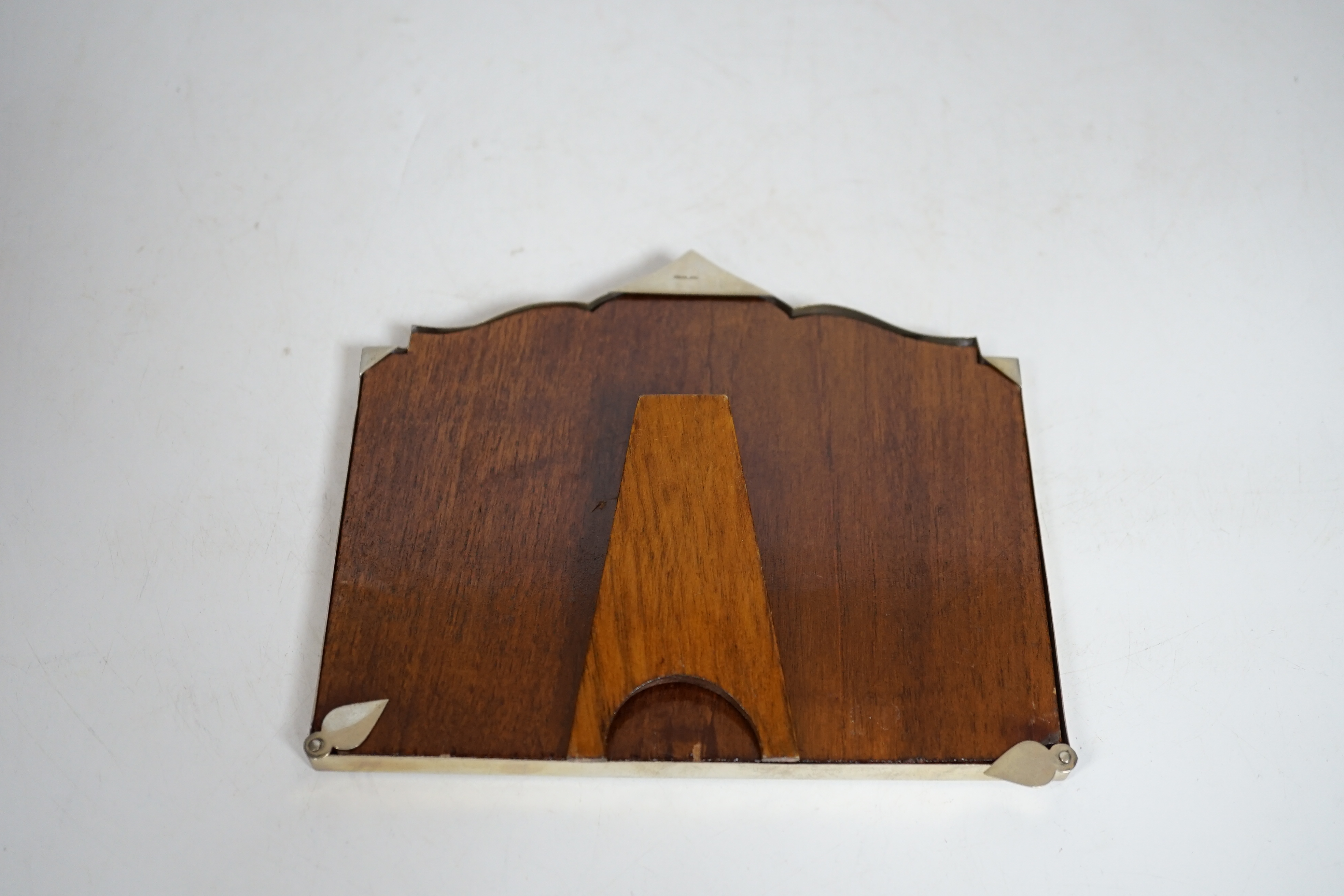 A Thai white metal cigarette box, stamped sterling, 14cm, and a similar sterling overlaid photograph frame, width 16cm